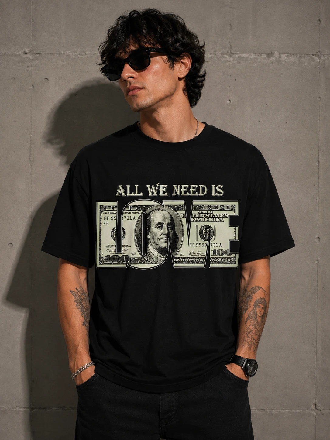 Model in a black oversized tee with banknote lettering spelling love