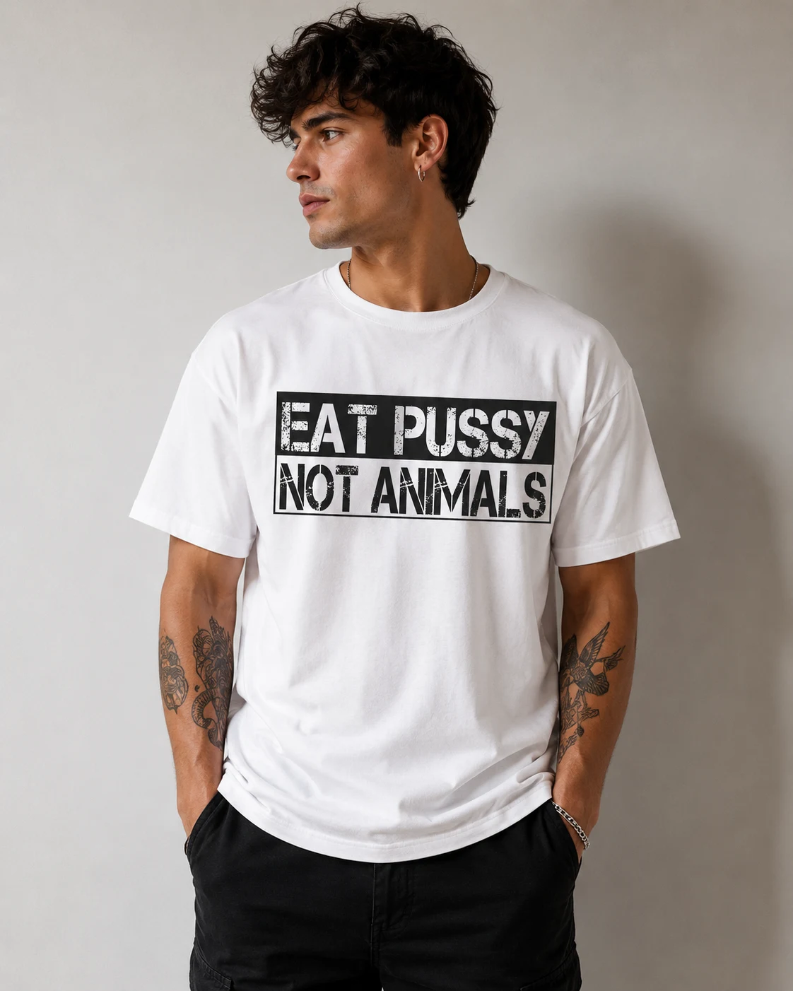 Model in a white Eat Pussy Not Animals t-shirt, stencil block print across the chest