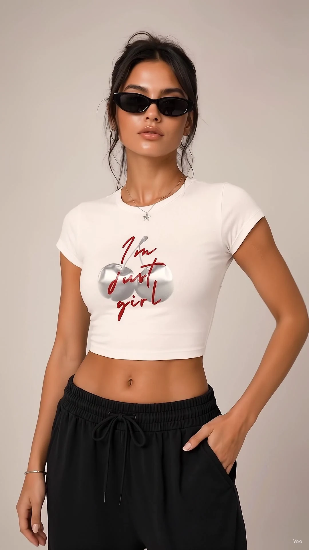 Model in a bone cropped tee reading I am just a girl