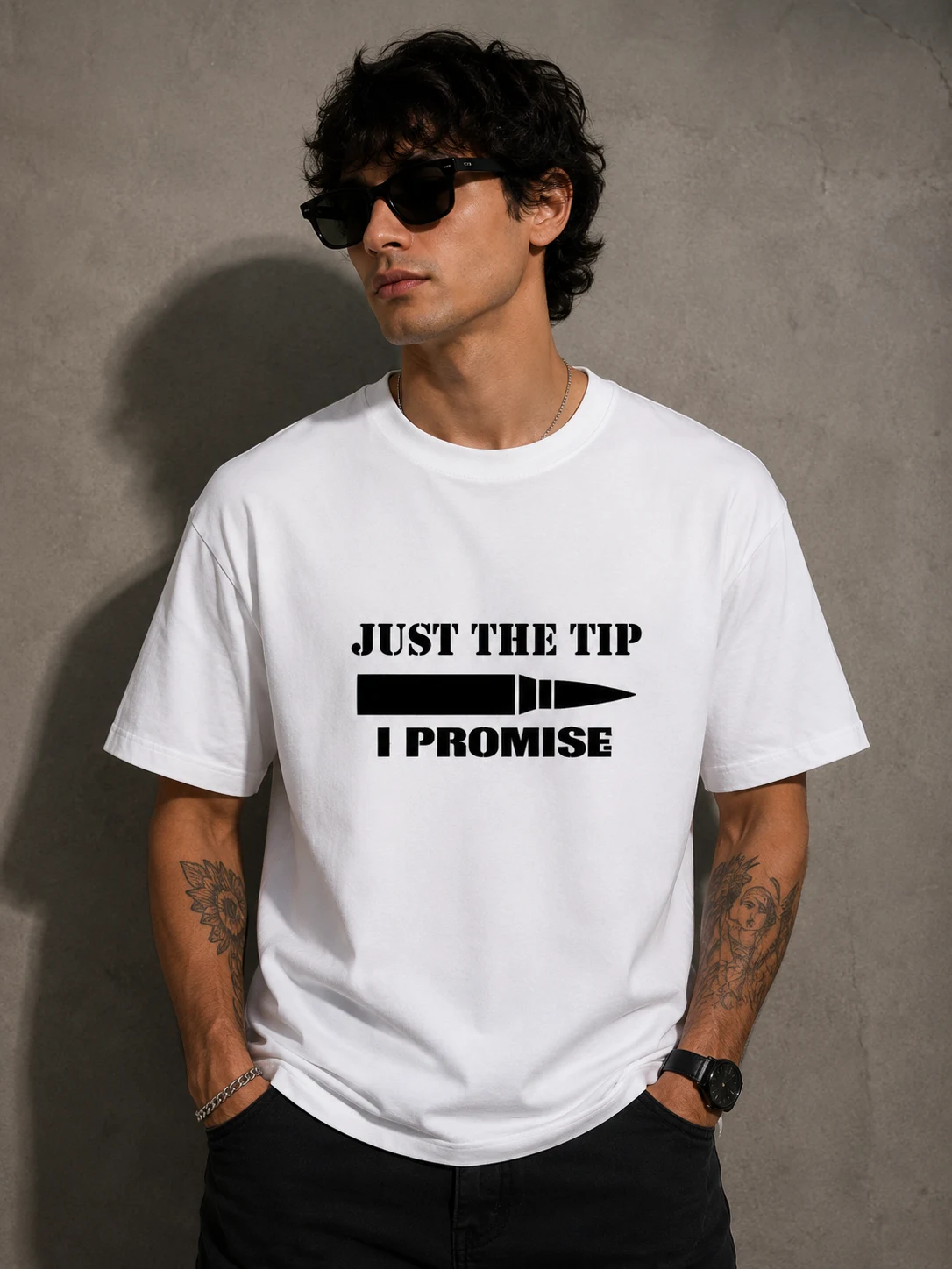 Model in a white tee reading just the tip, I promise