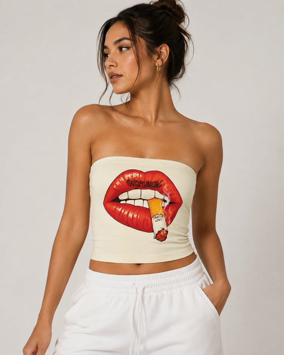 Model in a bone tube top, painted lips biting a lit cigarette printed across the front