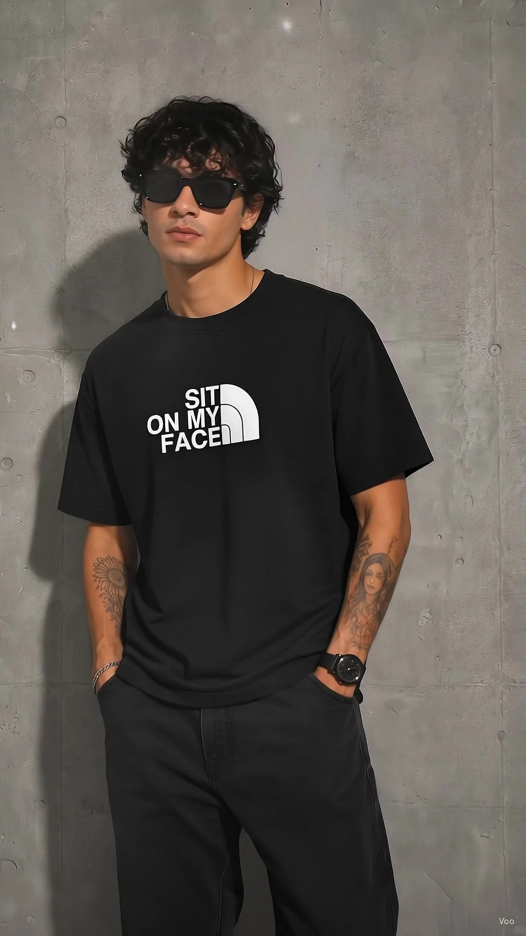 Model in a black tee with blocky outdoor-brand style lettering
